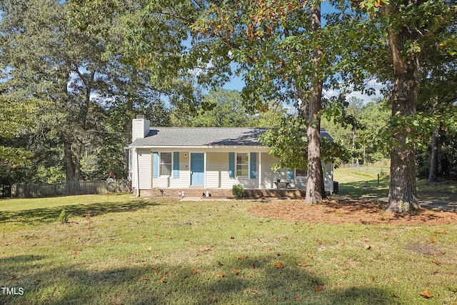 105 N Bend Dr, Knightdale, NC 27545 - view of front of house with a chimney, a front lawn, fence, and a porch