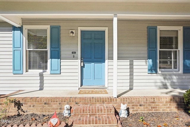 doorway to property with a porch