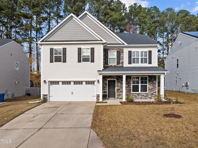 view of front facade with a front yard and a garage