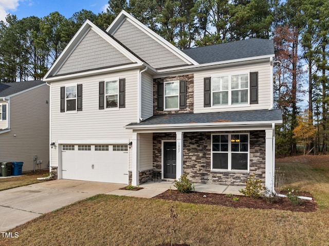 view of front of home with a garage and a front lawn