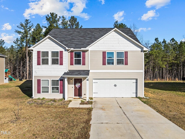 view of front facade featuring a front lawn and a garage