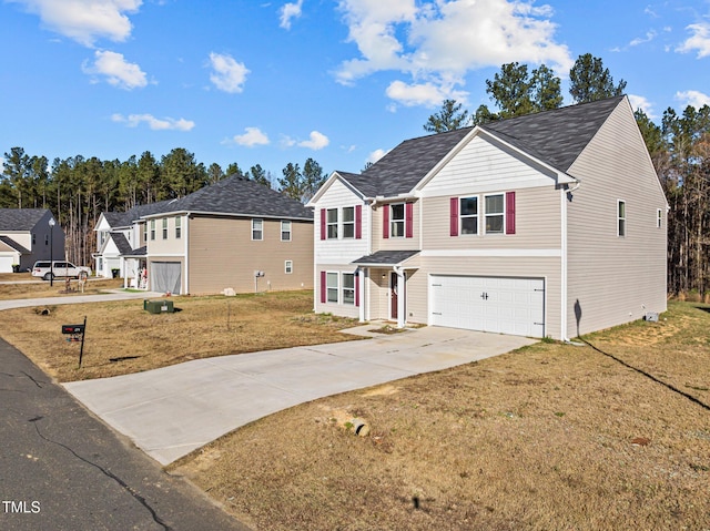 view of front of home featuring a front lawn and a garage