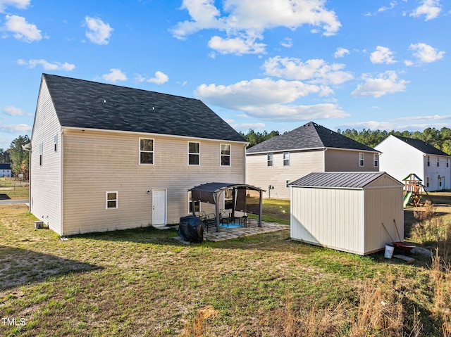 back of property featuring a yard and a patio