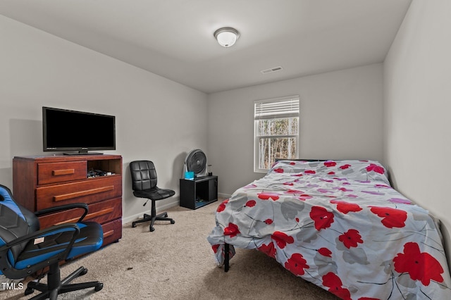 bedroom featuring light colored carpet