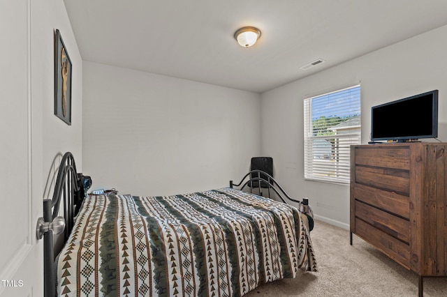 bedroom with light colored carpet