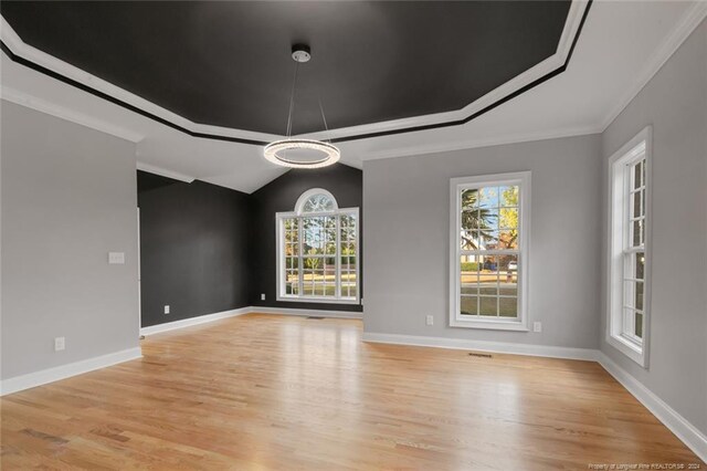 363 Kimberwicke Dr, Fayetteville, NC 28311 - unfurnished room featuring light wood-style floors, crown molding, baseboards, and lofted ceiling