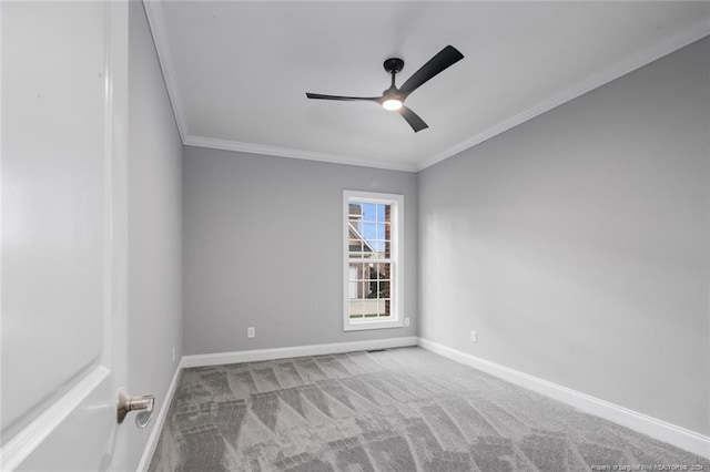 unfurnished room with carpet, ceiling fan, and crown molding