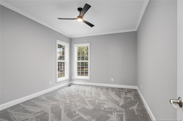 spare room featuring carpet flooring, ceiling fan, and ornamental molding