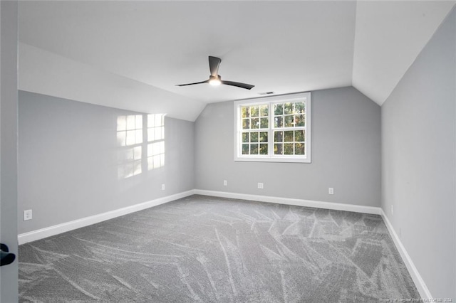 additional living space featuring carpet flooring, ceiling fan, and vaulted ceiling