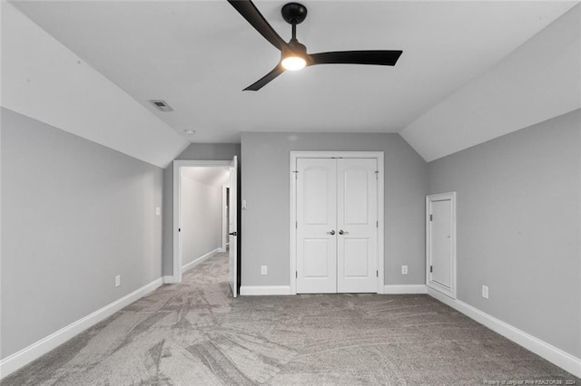 bonus room featuring light colored carpet, vaulted ceiling, and ceiling fan