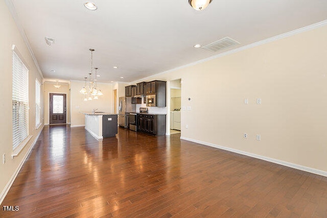 unfurnished living room featuring ornamental molding, dark wood-style flooring, and baseboards