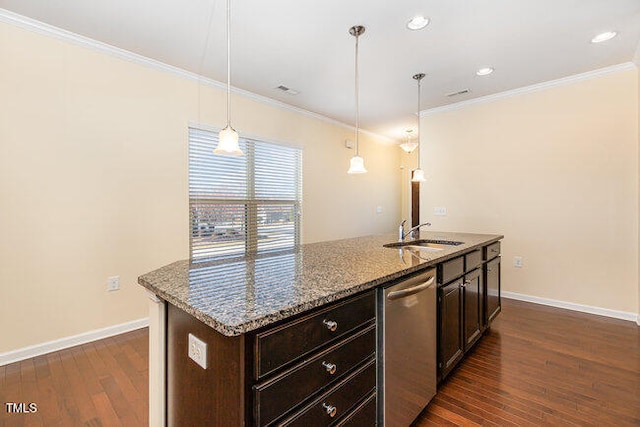 kitchen with pendant lighting, a sink, stainless steel dishwasher, and light stone countertops