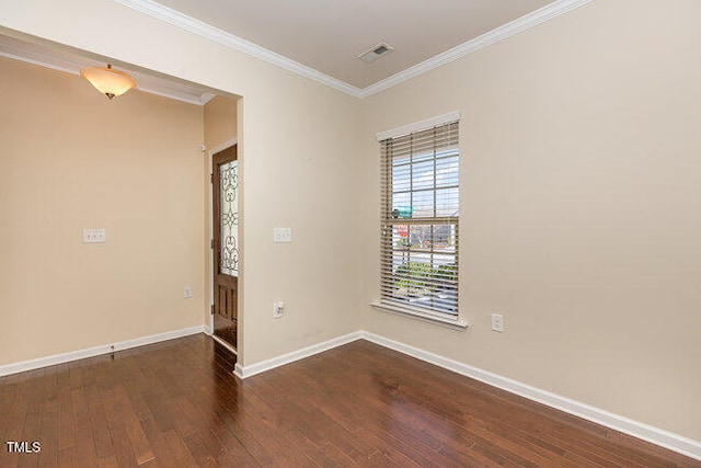 unfurnished room with baseboards, visible vents, dark wood-style flooring, and ornamental molding