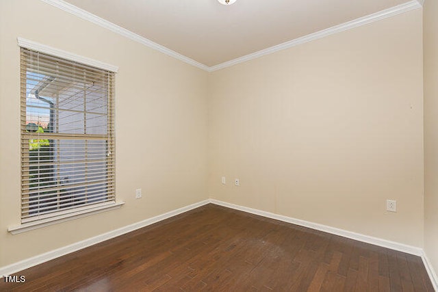 empty room with dark wood-style floors, baseboards, and crown molding