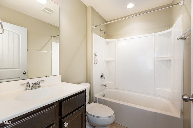 bathroom with toilet, shower / bath combination, visible vents, and vanity