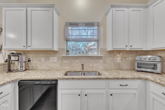 kitchen with dishwasher and white cabinets