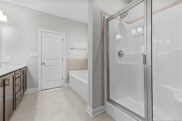 bathroom with vanity, tile patterned floors, and separate shower and tub