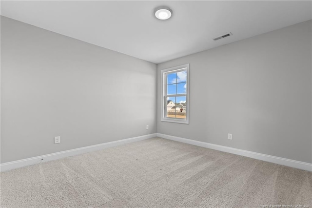 unfurnished room featuring carpet