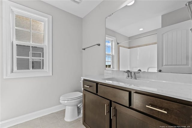 bathroom with vanity, toilet, a shower, and tile patterned floors