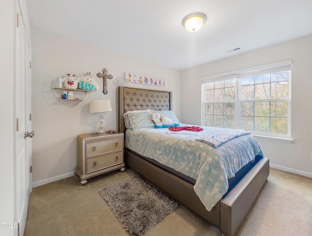 bedroom featuring light carpet