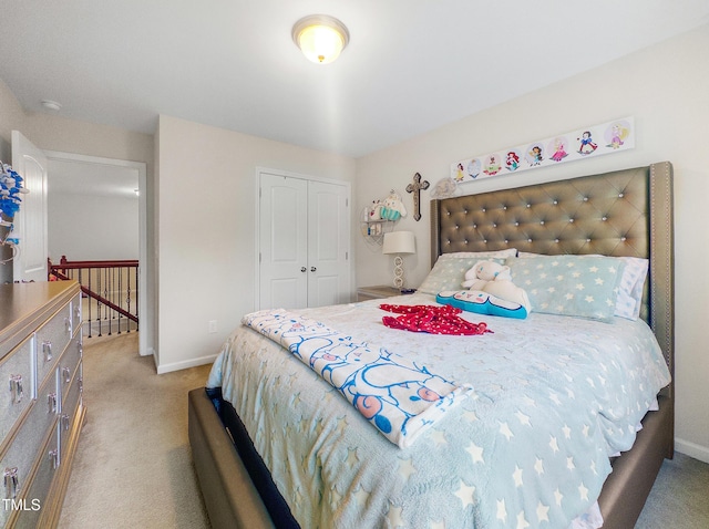 bedroom with carpet and a closet