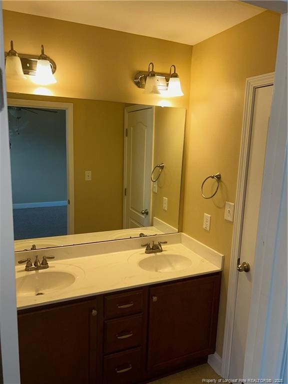 6605 Stillwood Dr, Hope Mills, NC 28348 - full bathroom with double vanity and a sink