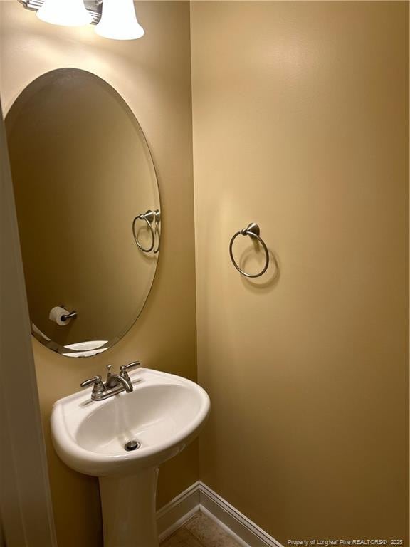 6605 Stillwood Dr, Hope Mills, NC 28348 - bathroom with baseboards