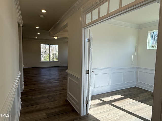 hall featuring crown molding and dark wood-type flooring