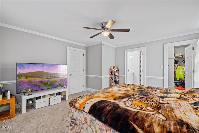 carpeted bedroom with ceiling fan, crown molding, and connected bathroom