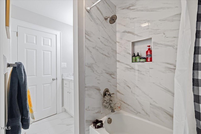 bathroom featuring vanity and shower / tub combo with curtain