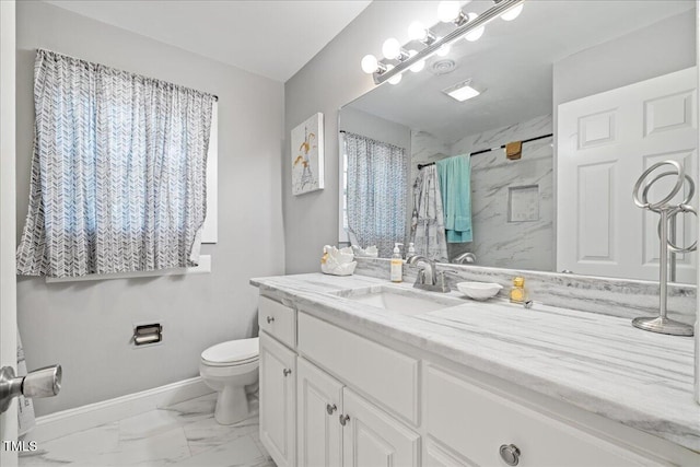 bathroom with curtained shower, vanity, and toilet