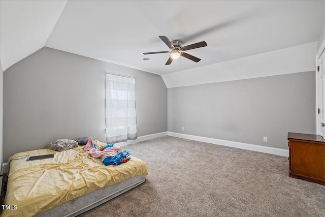 carpeted bedroom featuring ceiling fan and vaulted ceiling