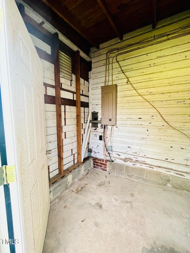 interior space with wood ceiling and wood walls