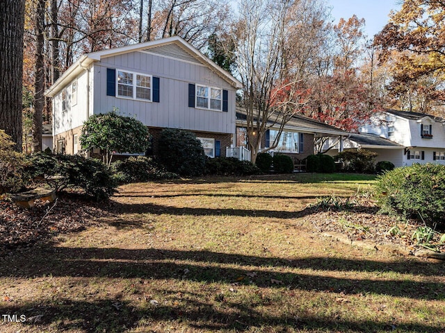 split level home with a front yard