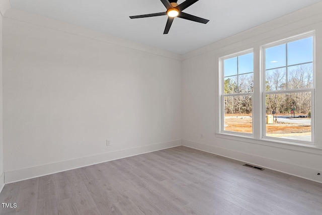 spare room with ceiling fan and light hardwood / wood-style floors