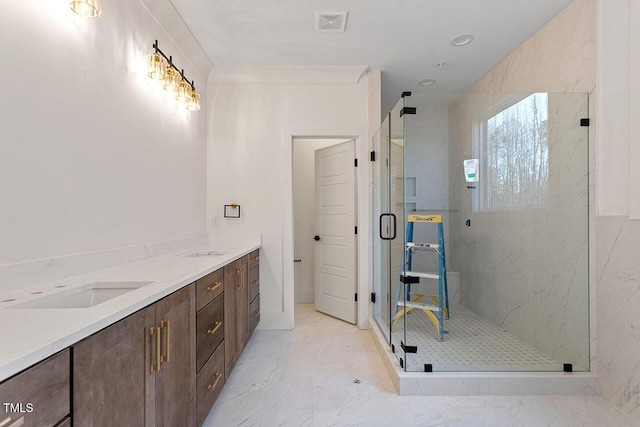 bathroom with walk in shower and vanity