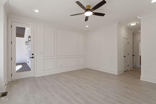 unfurnished room featuring ceiling fan, light hardwood / wood-style flooring, and crown molding