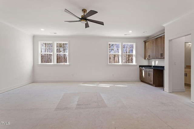 interior space featuring ceiling fan and crown molding