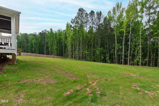 view of yard with a view of trees