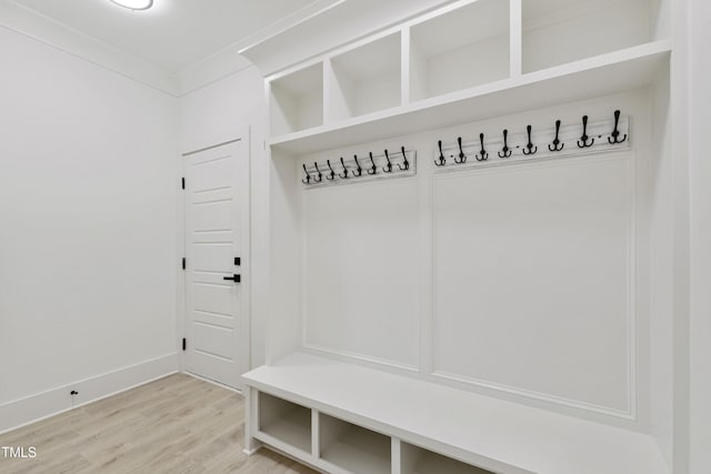 mudroom with light wood-style floors and baseboards