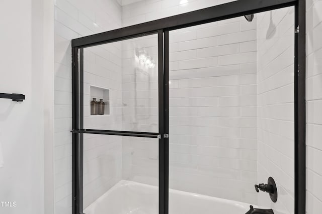 full bath with shower / bath combination with glass door