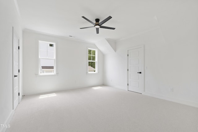 spare room featuring carpet, ceiling fan, and baseboards
