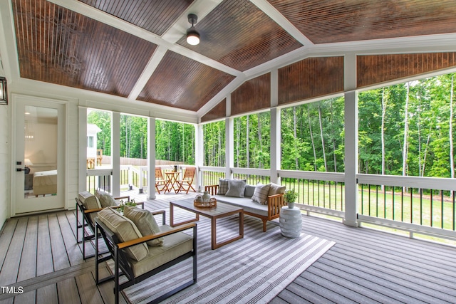 sunroom / solarium with vaulted ceiling and outdoor lounge area