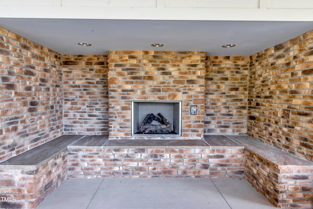 view of patio with a fireplace