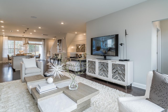 living room featuring dark wood-type flooring