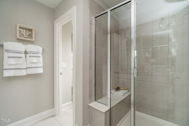 bathroom featuring tile patterned floors and a shower with door