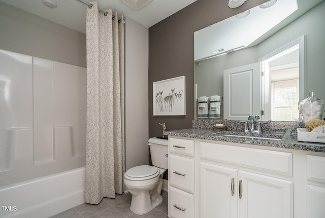 full bathroom featuring tile patterned flooring, shower / bath combo, vanity, and toilet