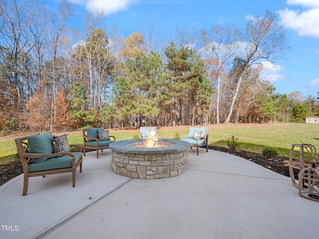 view of patio with an outdoor fire pit