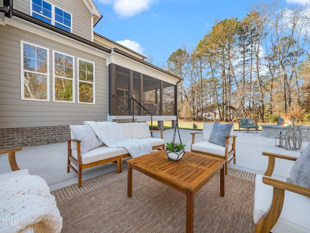 view of patio / terrace featuring an outdoor living space and a sunroom