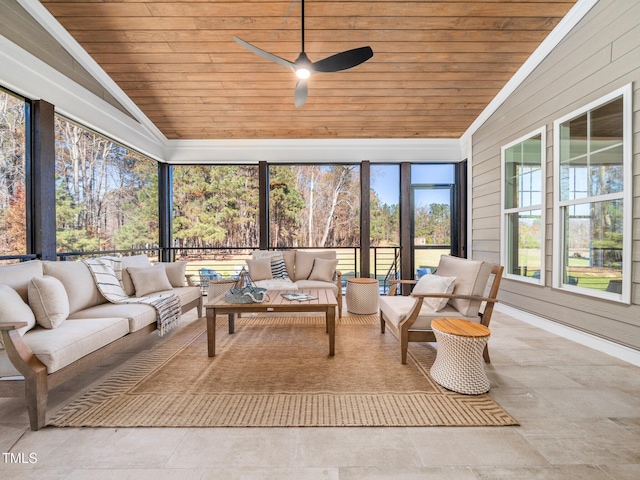 sunroom / solarium featuring ceiling fan, lofted ceiling, and wood ceiling